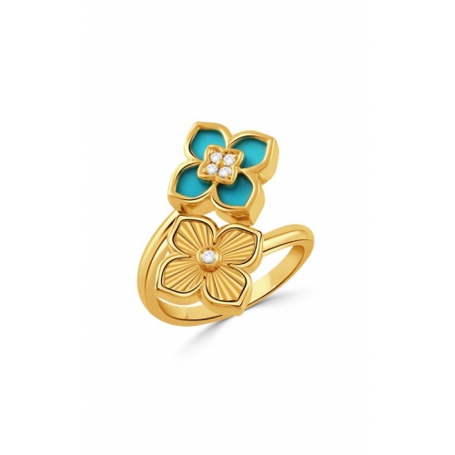 A gold ring featuring two floral designs: one with turquoise petals and small diamonds, and the other gold with a central diamond.