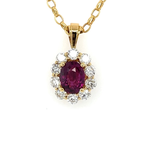 Gold necklace with an oval ruby pendant surrounded by sparkling diamonds.