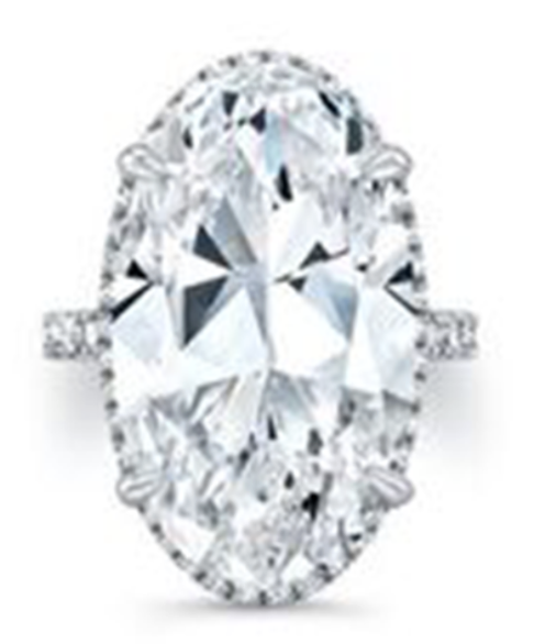 A white gold side stone engagement ring with massive oval cut center diamond.