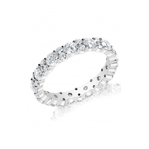 A silver eternity band with sparkling round-cut diamonds encircles the entire ring, displayed on a white background