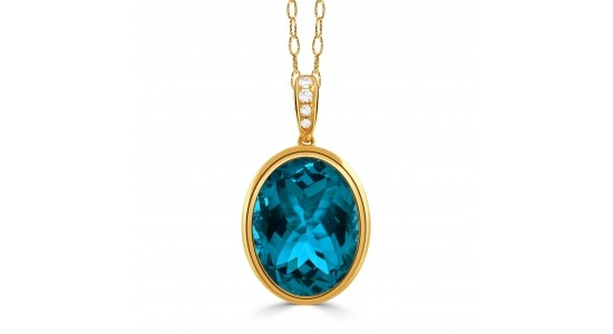 a yellow gold pendant necklace featuring oval cut london blue topaz