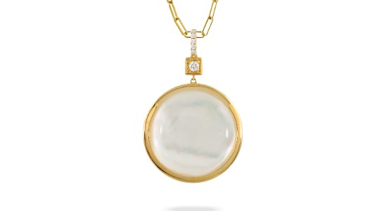 a yellow gold pendant necklace featuring mother of pearl and diamond accents