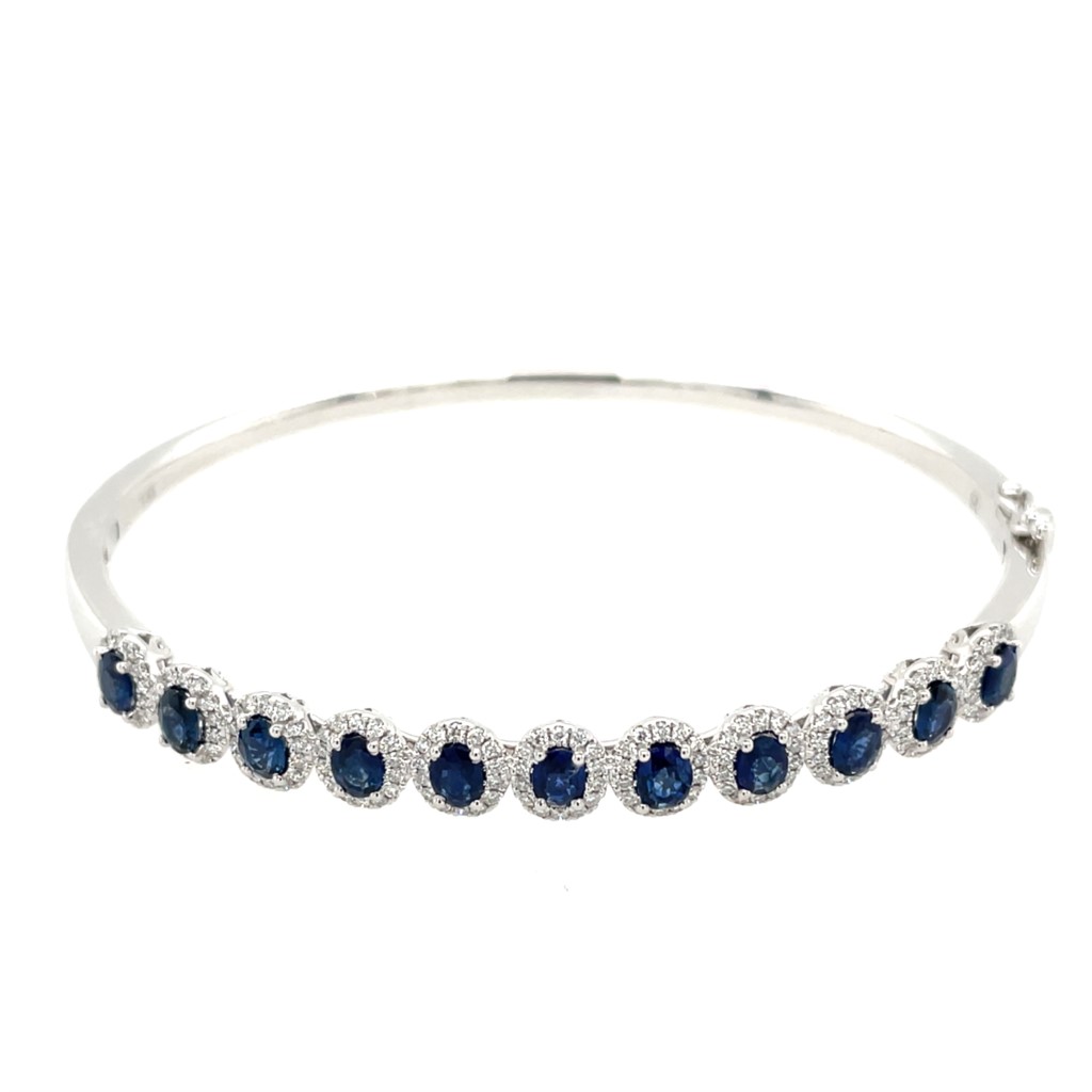 A white gold sapphire and diamond bangle.