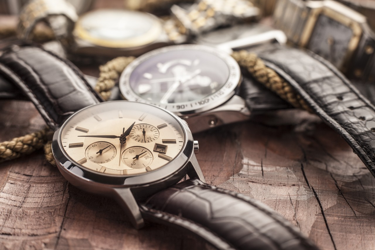close up of watches on a wood table