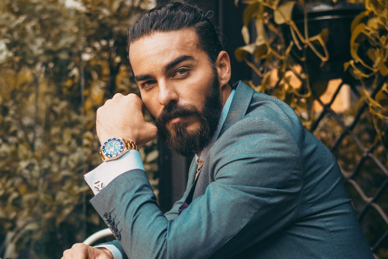 man wearing a suit and luxury watch