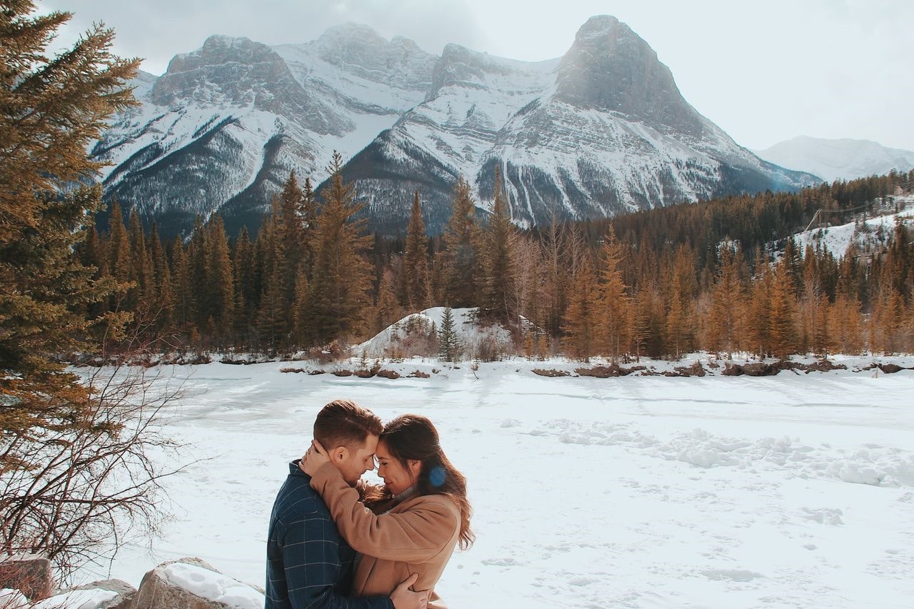 Romantic couple embracing in a snowy landscape