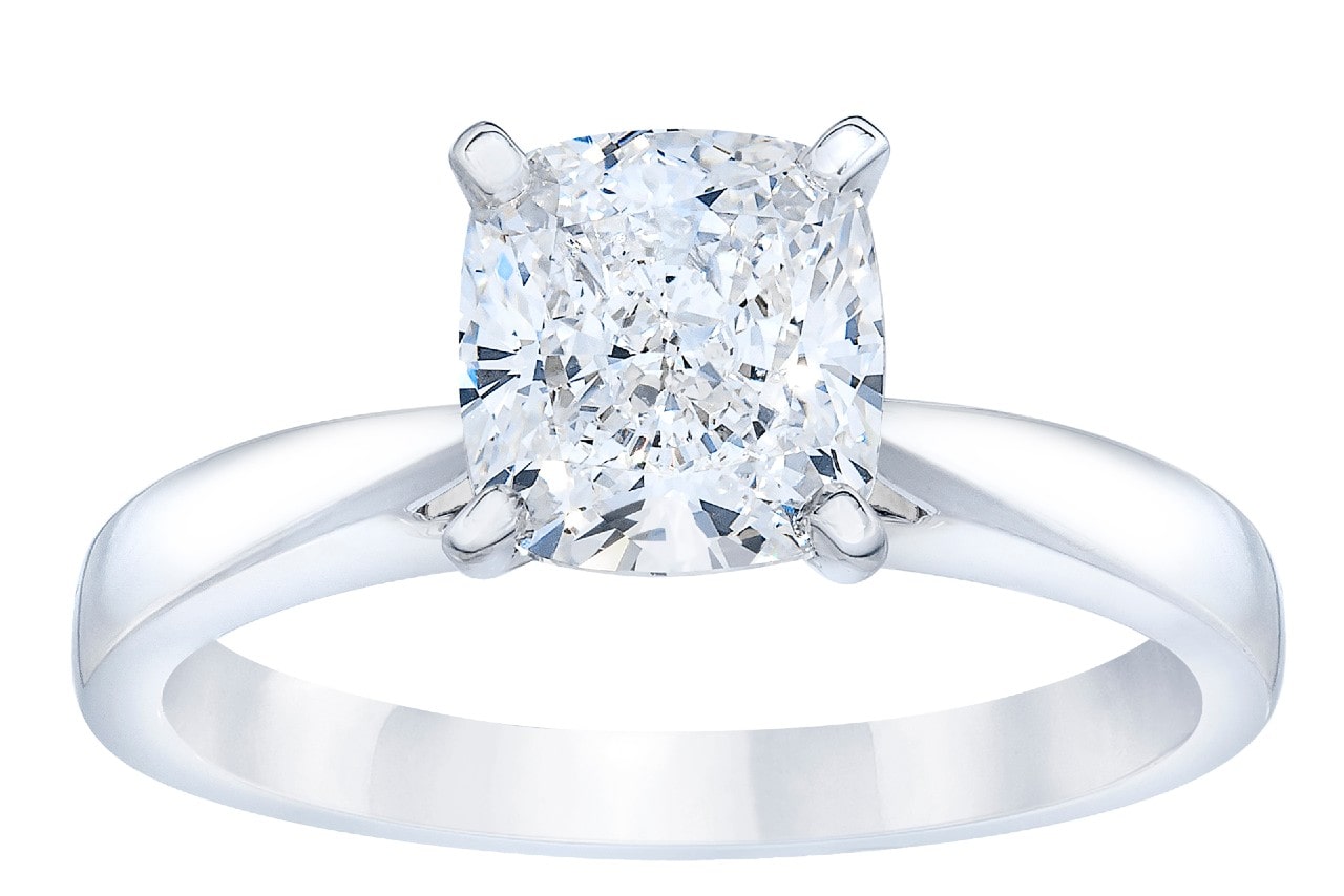 a solitaire engagement ring featuring a princess cut center stone and a white gold band