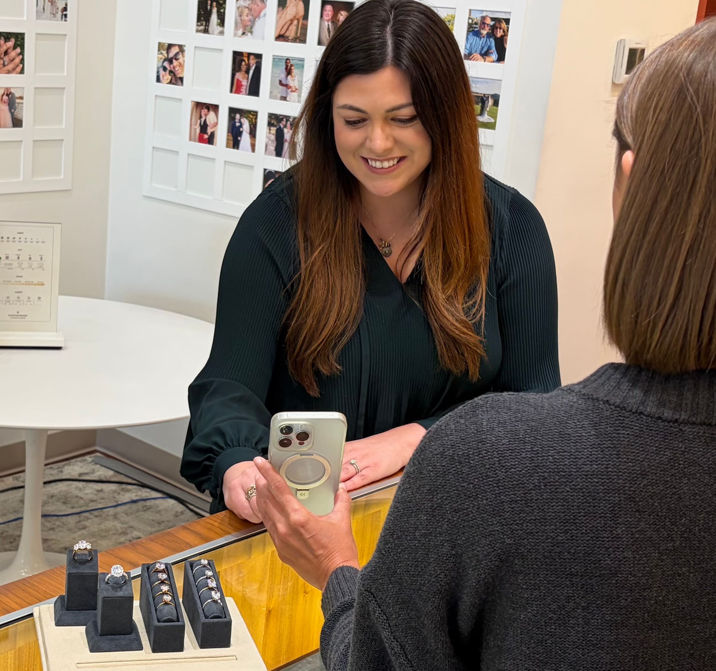 A photo banner featuring a jeweler and a customer sharing an engagement ring vision