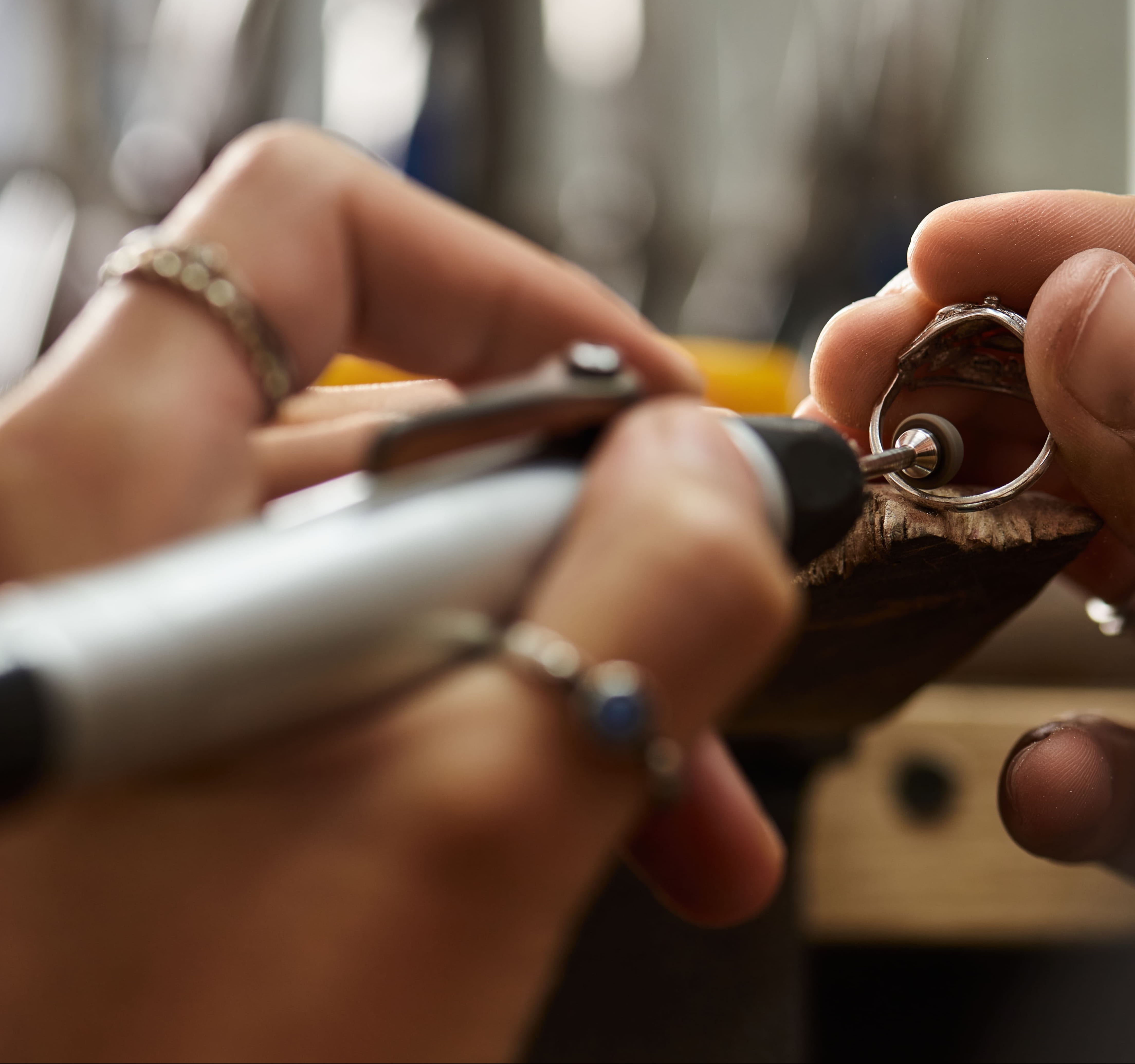 Banner of a jewelry designer crafting an engagement ring