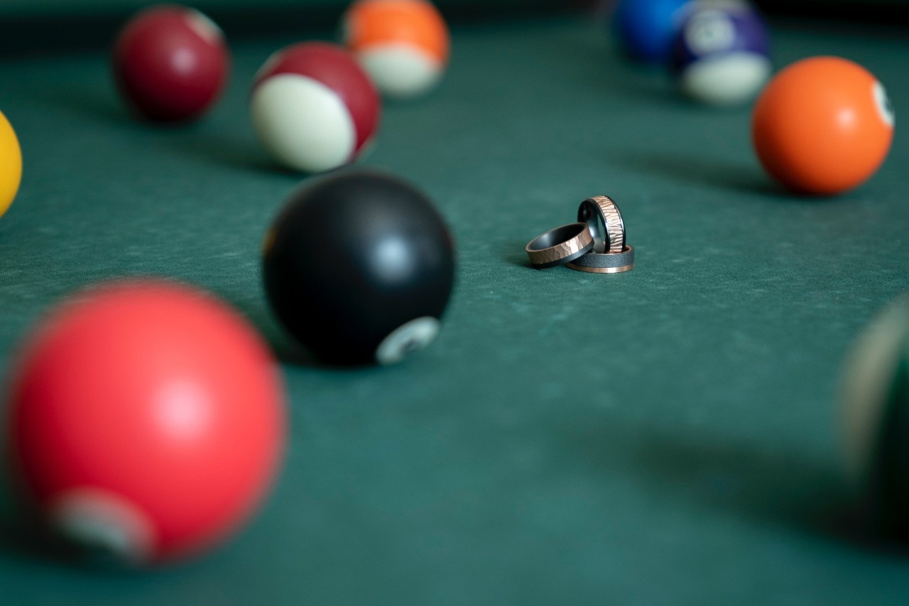 unique wedding bands on a pool table unique wedding bands on a pool table